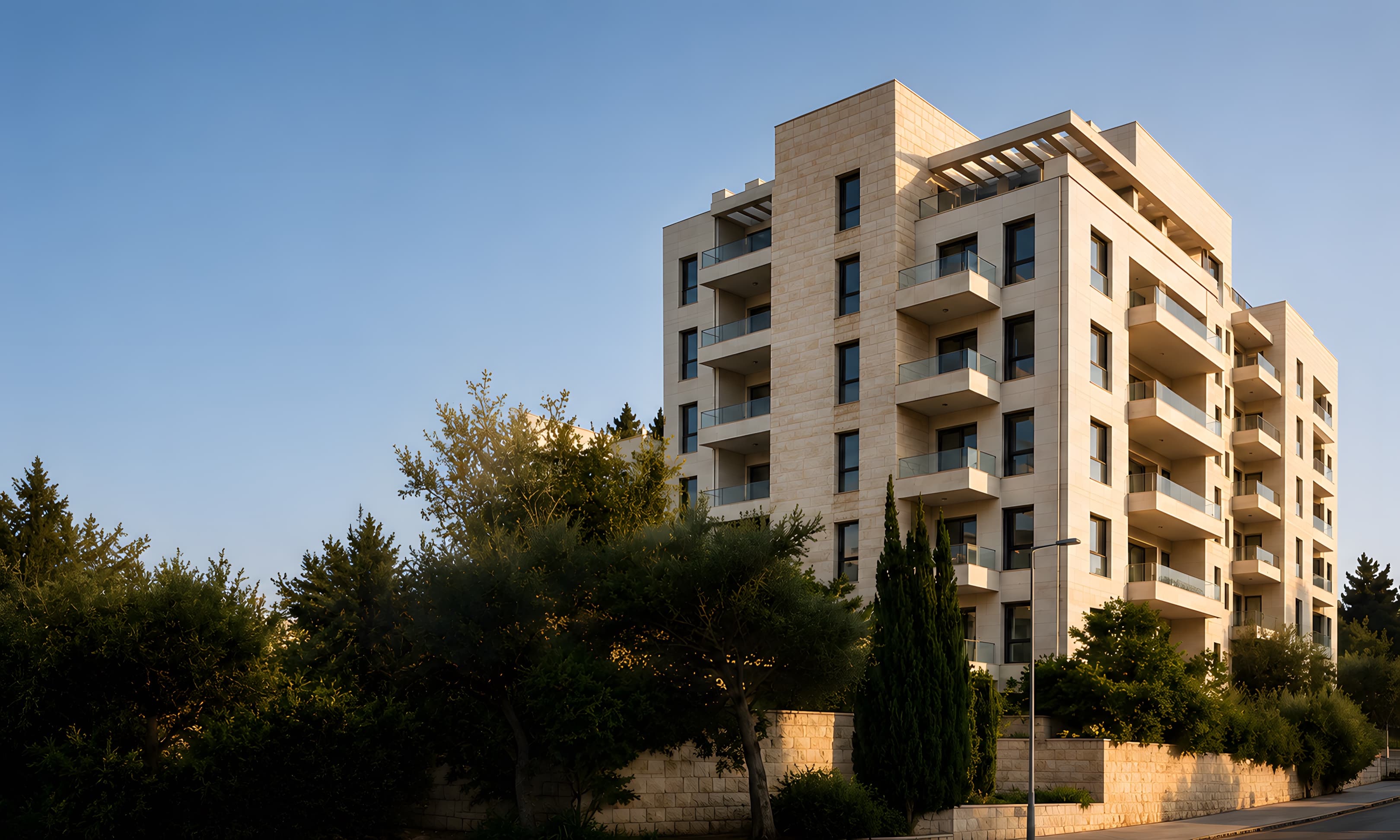 New Jerusalem-stone apartment building at dusk